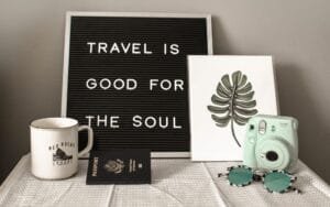 a black and white image showing travel is good for the soul