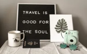 a black and white image showing travel is good for the soul
